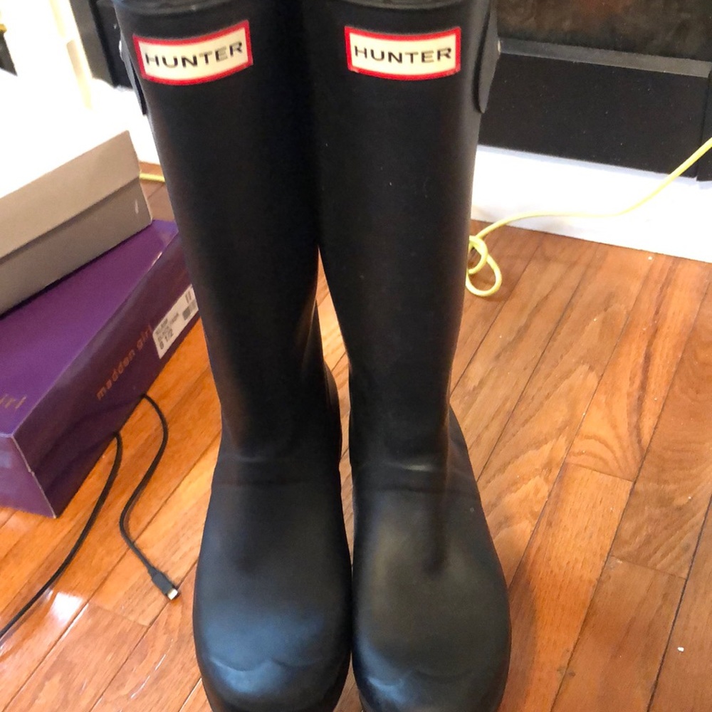 Tall hunter rain boots.